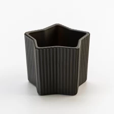 China Popular matte black glass candle jar with star design manufacturer