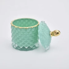 China Customized green embossed glass candle jar with lid wedding decoration manufacturer