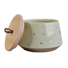 China In bulk color home decoration ceramic candle holder with wood lid manufacturer