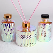 porcelana Botellas difusoras de vidrio redondas galvanizadas grabadas con tapas fabricante