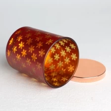China electroplated spray color opaque laser hollow snowflakes pattern red and golden glass candle jar with lid manufacturer
