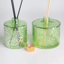 China transparent green electroplated laser fleck finished screw neck cylindrical glass diffuser bottle manufacturer