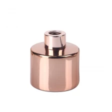 China 100ml 3.5oz cylindrical electroplated rose gold glass diffuser bottle with rosegold screw cap manufacturer