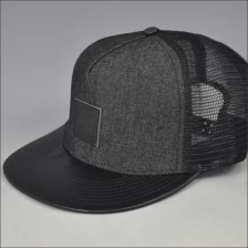 China fashion leather brim trucker mesh hat/cap with leather patch manufacturer