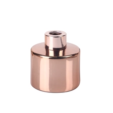 China 100 ml cilindrische, gegalvaniseerde roségouden glazen diffusorfles van 3,5 oz met roségouden schroefdop fabrikant