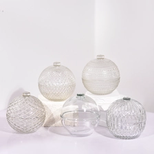 China Ball Shaped Glass Candle Jar With Lids Custom Color Christmas Glass Candle Jars Wholesale manufacturer