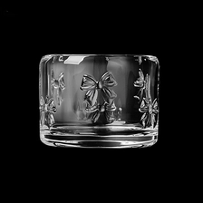 China Hot Sale Popular Bow Embossed Pattern Glass Candle Holder For Home Decoration manufacturer