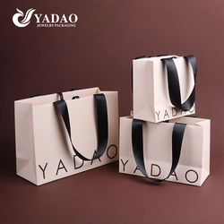 China Premium customizable glitter special paper bag ribbon handle for perfume jewelry businesses manufacturer