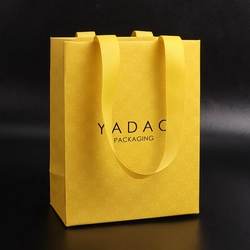 China Fancy style boutique shopping accessory gift packaging paper ribbon bag manufacturer