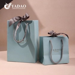 China Bespoke Paper Gift Bags Luxury Perfume Jewelry Brands Watch box packaging handle bag manufacturer