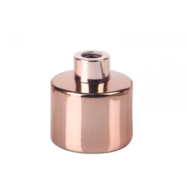 China 100ml 3.5oz cylindrical electroplated rose gold glass diffuser bottle with rosegold screw cap manufacturer