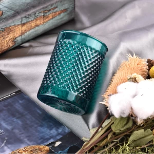 Modern custom recessed green glass candle jar with grain pattern