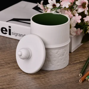 Customized white and dark green engraved ceramic candle holder with lid