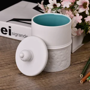 Wholesale three-dimensional carved ceramic candle jars with lids for home decoration containers
