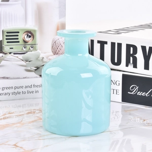 Maßgeschneiderte hellblaue zylindrische Glasduftflasche für luxuriöse Raumdüfte