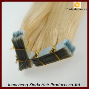 An tSín 2015 best selling natural look 10-30 inch brazilian remy tape hair extensions déantóir