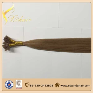 An tSín Stick I tip hair extension blonde color déantóir
