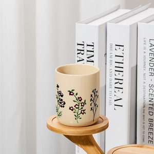 Barattolo di candela in ceramica botanica dipinta a mano color crema all'ingrosso