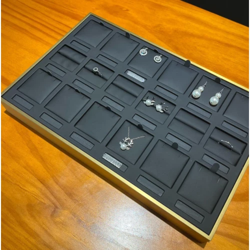 China Heavy metal luxurious pu leather rings earrings price tag jewelry display props storgae tray manufacturer