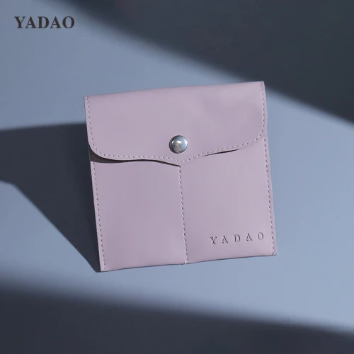 jewelry safe organized with stylish purple leather jewelry pouch bag