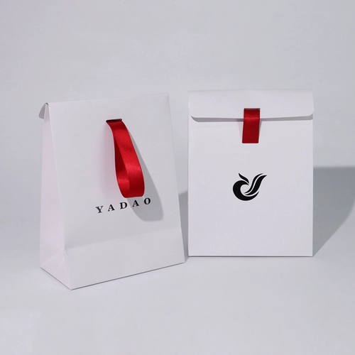 China triangle shape CMYK printing art paper bag gift bag jewelry shopping paper bag manufacturer
