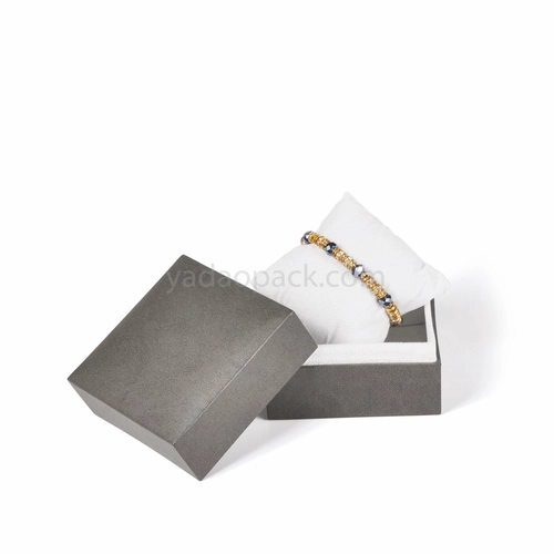 Caja de joyas / relojes con almohada y tapa separada.