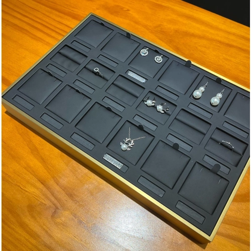 China Heavy metal luxurious pu leather rings earrings price tag jewelry display props storgae tray manufacturer