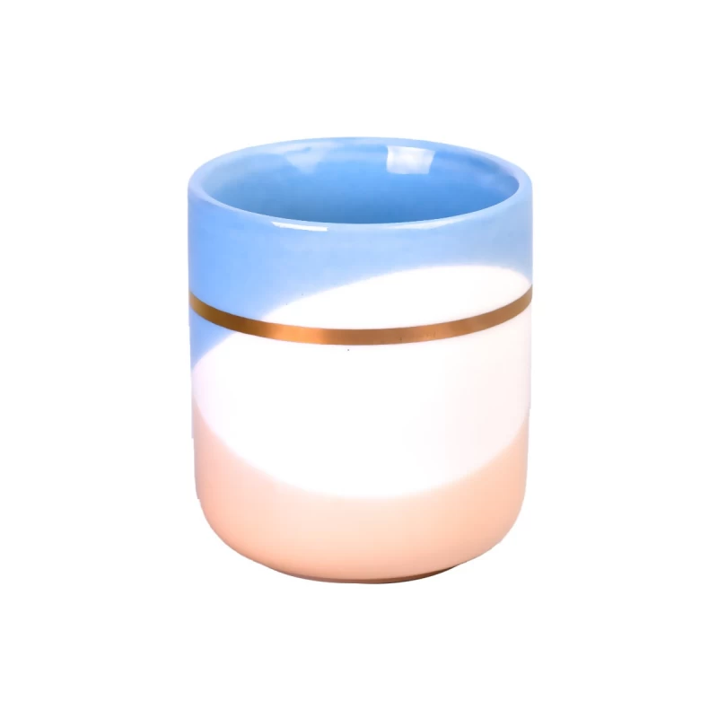 Kundenspezifisches leeres Keramikkerzenbehälterglas mit goldener Schleife, blau-weiß-orangefarbenem Wellenmuster