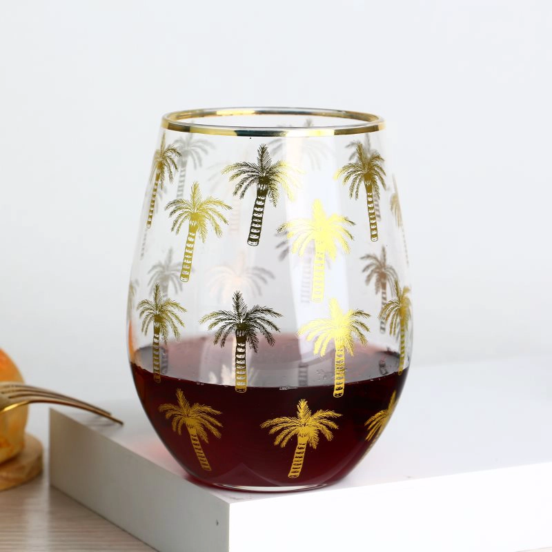 Gouden rand stengelloze wijnglas tuimelaars met palmpatroonstickers
