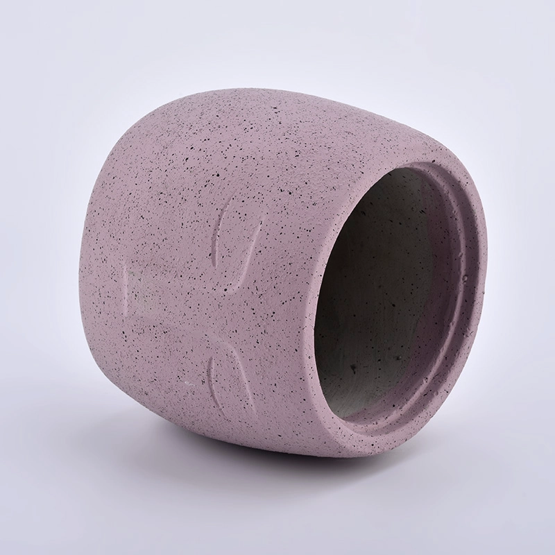 large concrete candle jars with face pattern