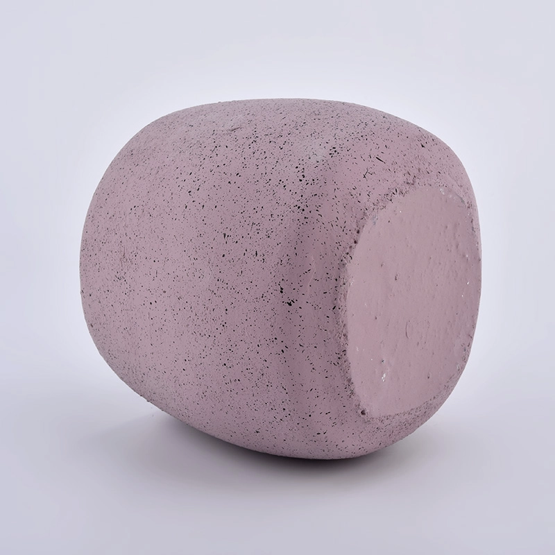 large concrete candle jars with face pattern