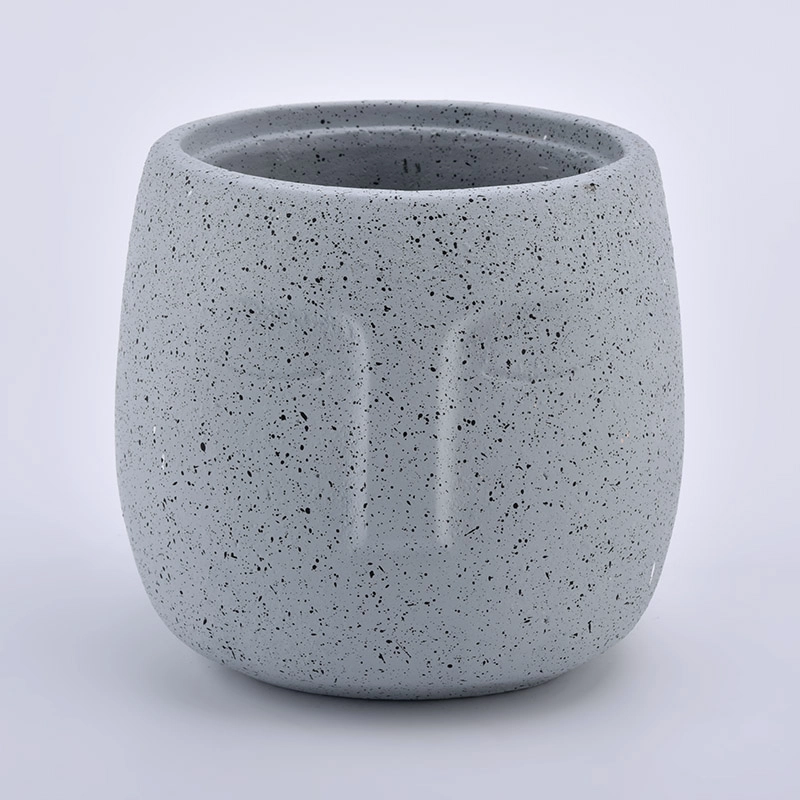 large concrete candle jars with face pattern