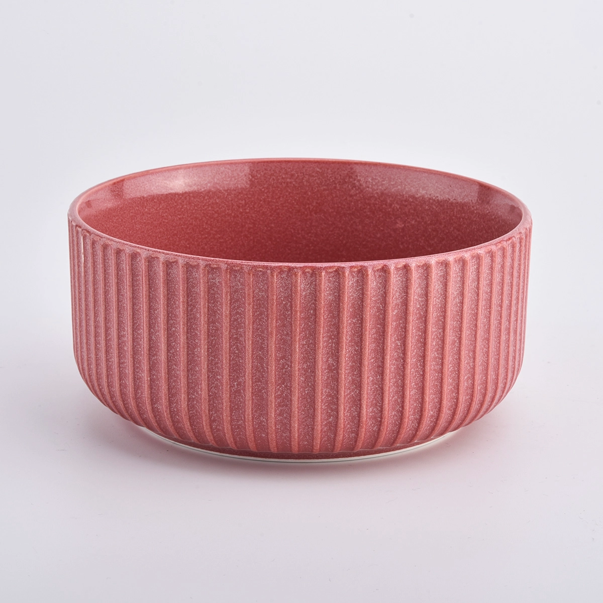 Large colorful glazed ceramic candle jars with stripe design
