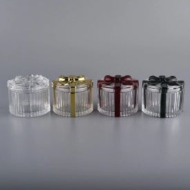 Bowknot progetta un contenitore per candele di vetro d’oro con coperchio