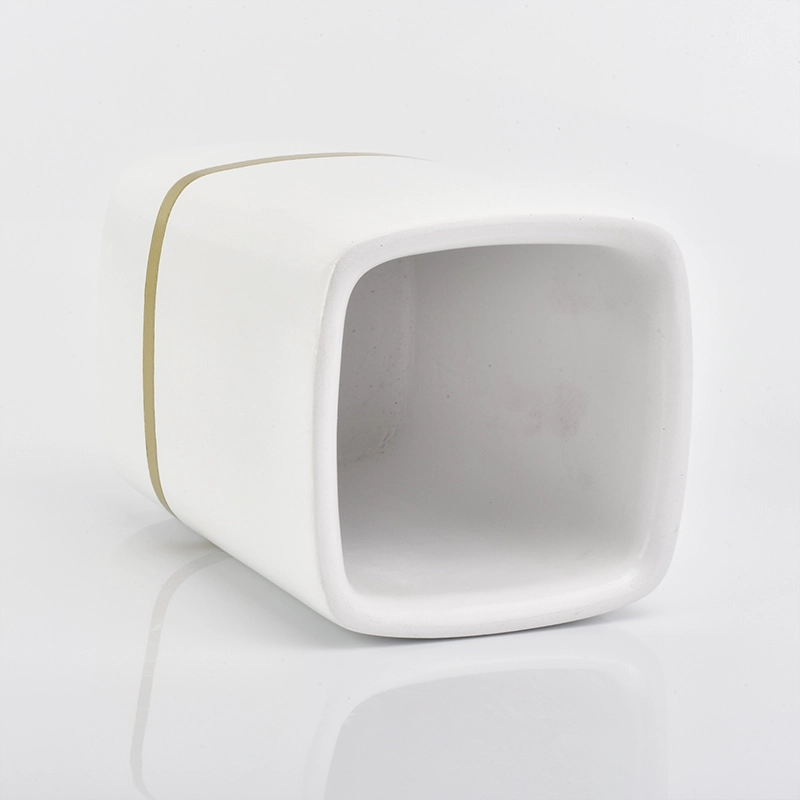 white rectangle concrete candle jars