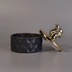 Matte black ceramic containers with gold animal lids