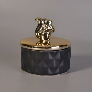 Matte black ceramic containers with gold animal lids