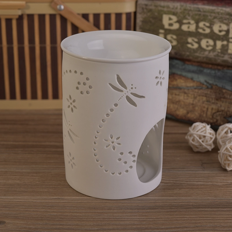 White ceramic candle burner with hellow out dragonfly pattern White ceramic candle burner with hellow out dragonfly pattern