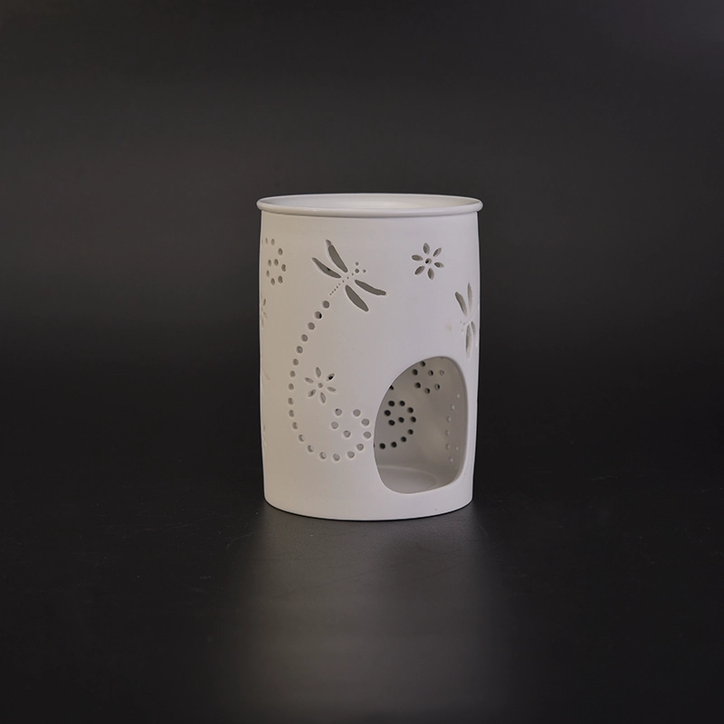 White ceramic candle burner with hellow out dragonfly pattern White ceramic candle burner with hellow out dragonfly pattern