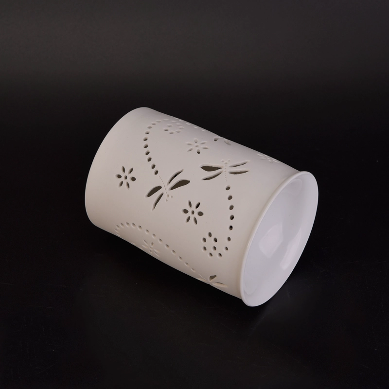 White ceramic candle burner with hellow out dragonfly pattern White ceramic candle burner with hellow out dragonfly pattern