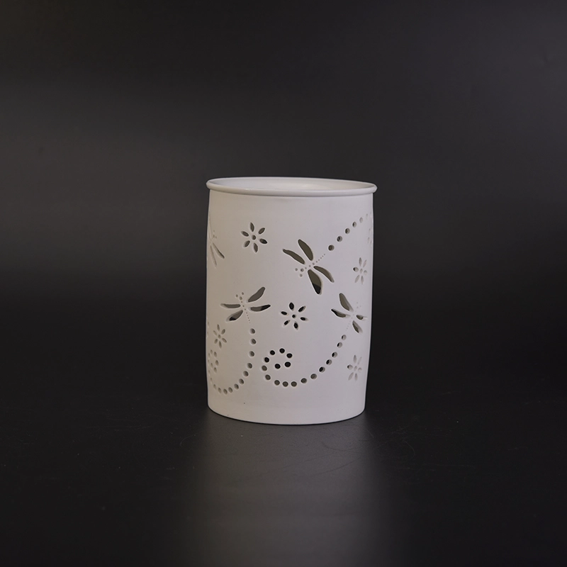 White ceramic candle burner with hellow out dragonfly pattern White ceramic candle burner with hellow out dragonfly pattern