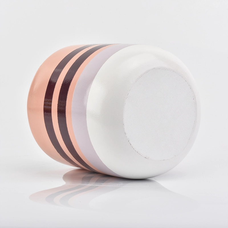pink line decorated concrete candle container with golden inside