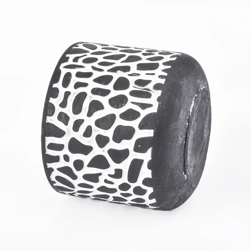 black candle jar with white decorative lines