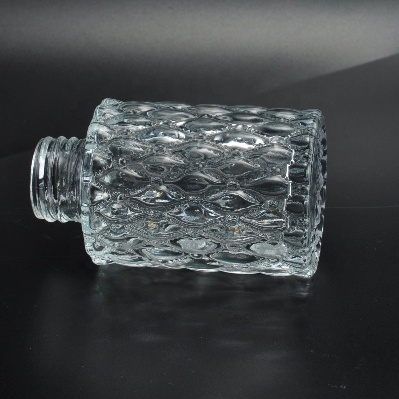 ODM Transparent embossed glass container oil essential perfume spray bottles factory
