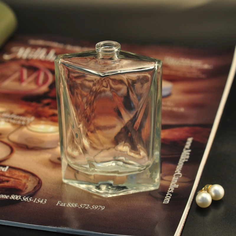 Empty embossed perfume fragrance oil bottle
