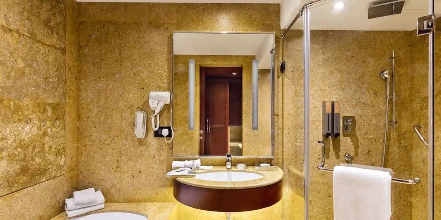 glass shower door at home bathroom