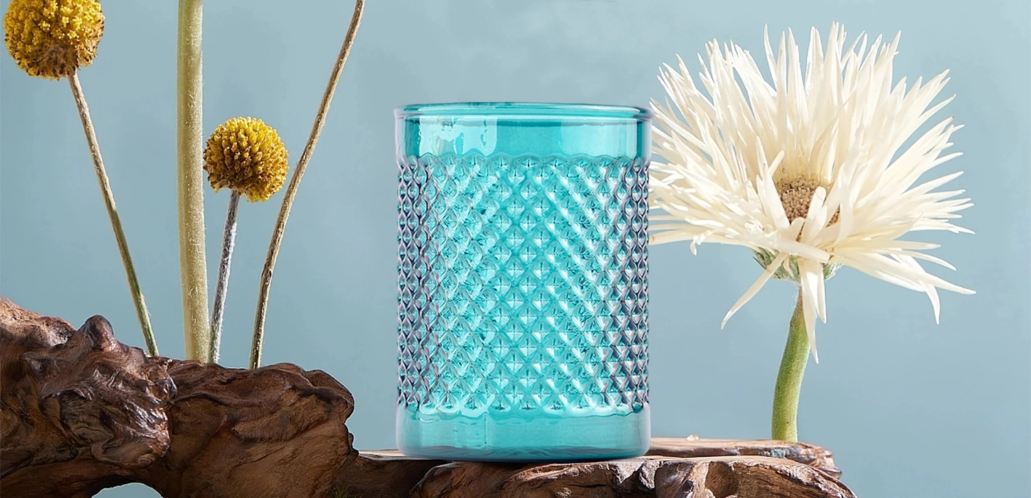 Modern custom recessed green glass candle jar with grain pattern Modern custom recessed green glass candle jar with grain pattern