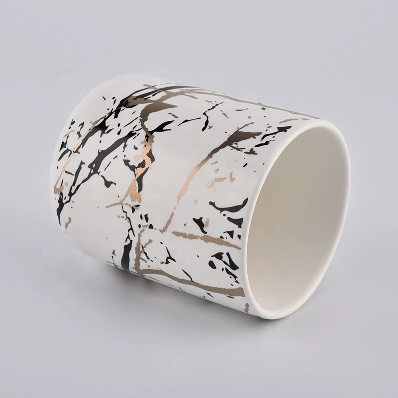 matt white ceramic candle jars with artwork