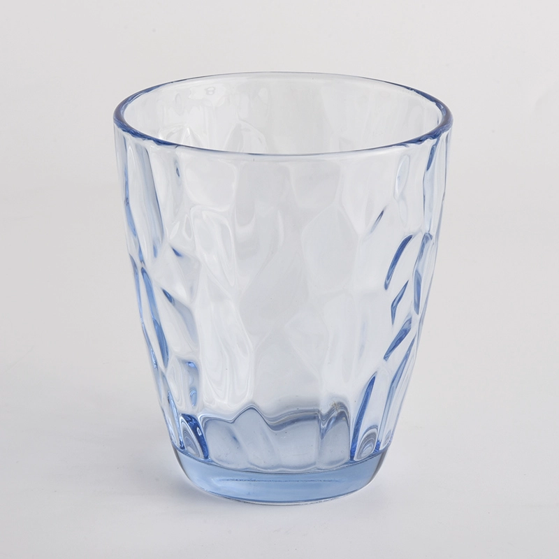 transparent blue glass candle holders with knock patterns