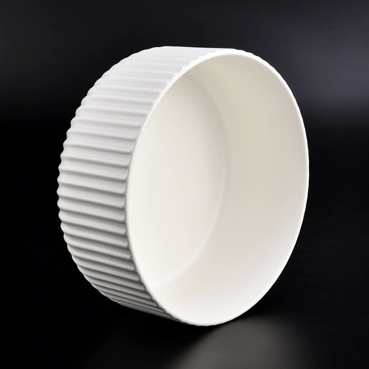matte white glazed ceramic candle jars with stripe designs